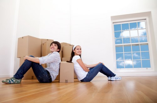Careful loading of household items into a moving van in Kentish Town