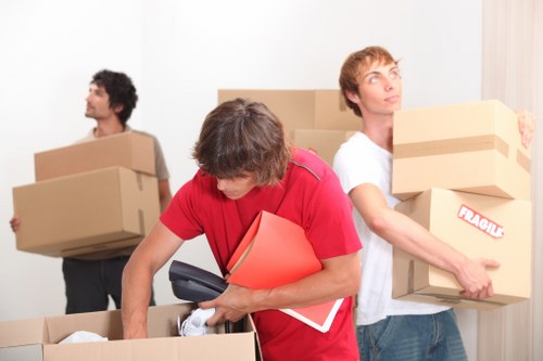 Packed moving boxes and household items ready for transport in Kentish Town