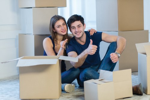 Professional movers loading furniture for a flat move in Kentish Town