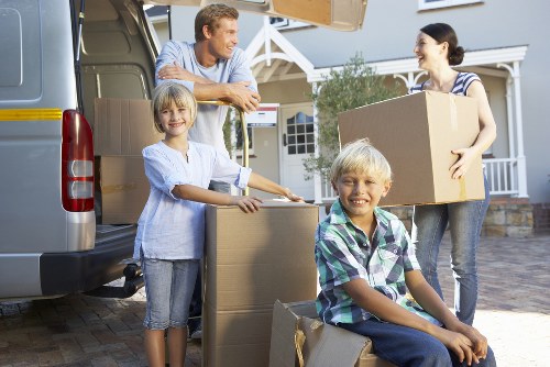 Boxes and furniture being loaded into a removals van
