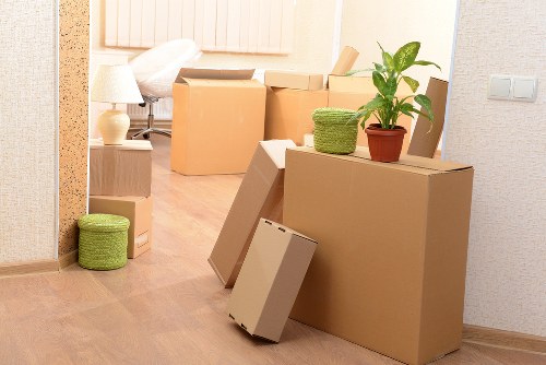 Boxes and furniture prepared for transport by a Kentish Town moving van