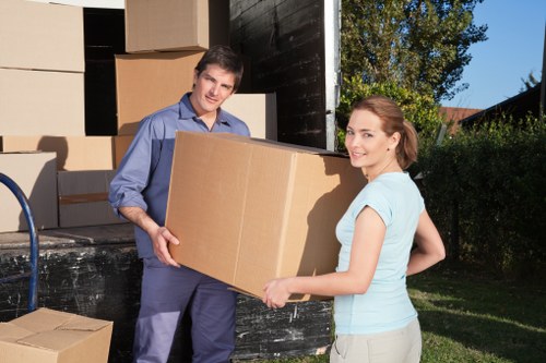 Professional movers handling furniture in a flat move